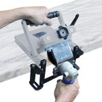 Abaco Air Polishing Machine 80M1 positioned on a vertical stone slab edge