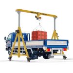 Abaco Easy Adjustable Crane 500 lifting a palletized load from a truck bed