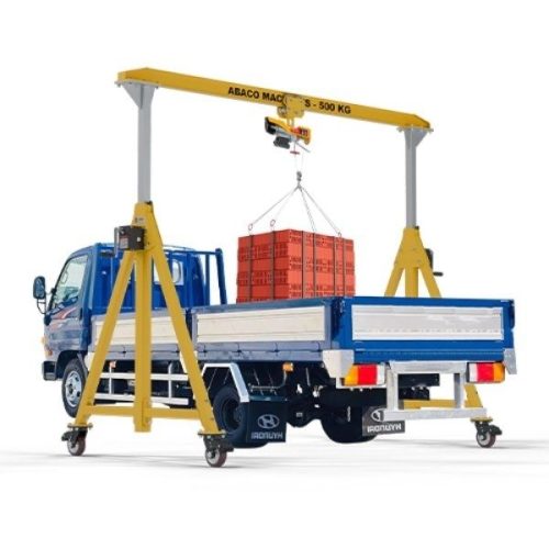 Abaco Easy Adjustable Crane 500 lifting a palletized load from a truck bed