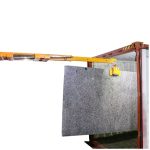 ABACO Smart Forklift Boom 27 lifting a stone slab from a shipping container
