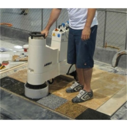 Achilli LM/30-CE in use grinding natural stone floor surface