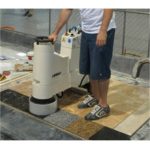 Achilli LM/30-VE in use grinding natural stone floor surface