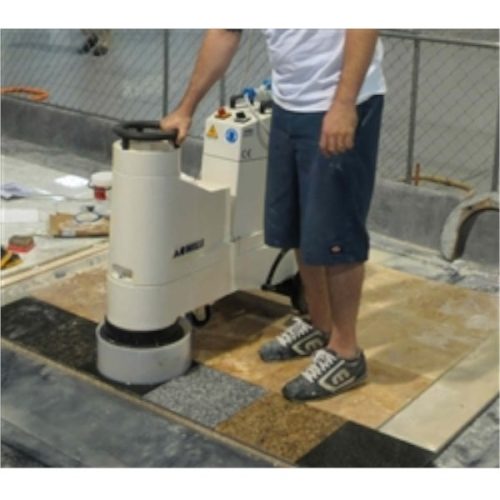 Achilli LM/30-VE in use grinding natural stone floor surface