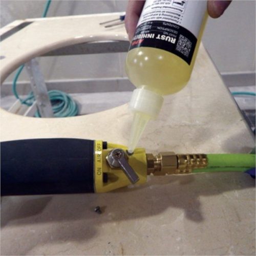 Alpha AIR-008 Rust Inhibitor Oil being applied to a pneumatic tool oil port