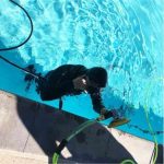 ALPHA AIR-680UW pneumatic polisher operating underwater on a swimming pool surface