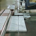 Close-up showing Alpha Dry Porcelain Paver Tile Cutting System blade aligned with a tile cut