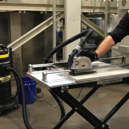 Alpha Dry Porcelain Paver Tile Cutting System operating with connected vacuum hose