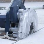 Close-up showing Alpha ECC-125 Ecocutter blade positioned on tile