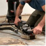 Worker operating Alpha Ecoguard 7″ Grinding Kit on a floor surface