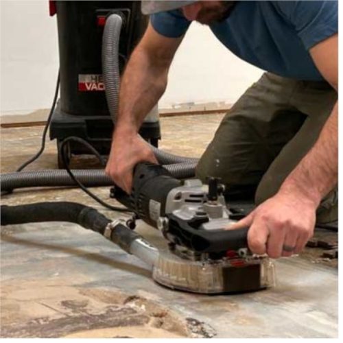 Worker operating Alpha Ecoguard 7″ Grinding Kit on a floor surface