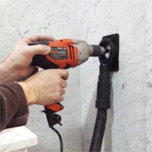 Worker drilling a vertical stone surface with Alpha Ecoguard CD