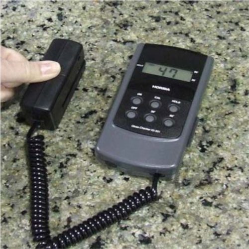 Alpha Gloss Checkers IG-331 measuring gloss on a polished stone surface