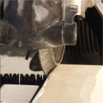Close-up Alpha Marble Profile Wheel contacting a marble tile edge