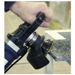Worker using Alpha Paver Tile Bullnose Kit to shape a paver tile edge