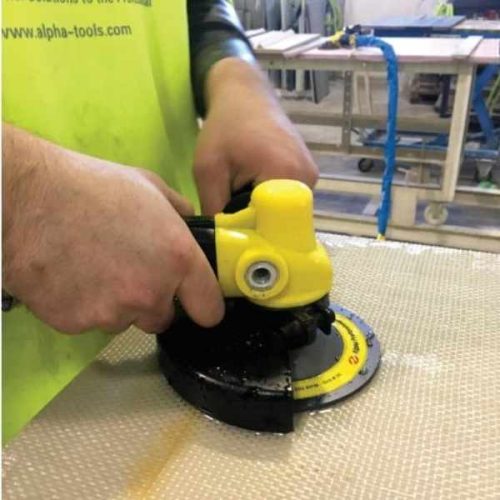 ALPHA PSC-600 Pneumatic Stone Cutter grinding a wet stone surface