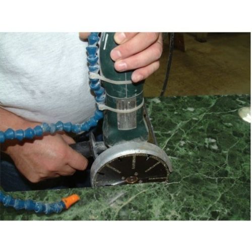 Alpha Vortex for Marble mounted on a handheld grinder cutting marble