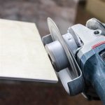DiStar Hard Ceramics DGM 2″ Grinding Wheel 60/70 positioned beside a ceramic tile edge
