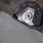 Mechanic DUSTER in use for controlled 45-degree tile edge cutting