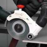 Worker using Mechanic ROLLER 4.5″-5″ for guided tile cutting