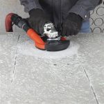 Mechanic VORTEX installed on angle grinder for dust-controlled concrete grinding