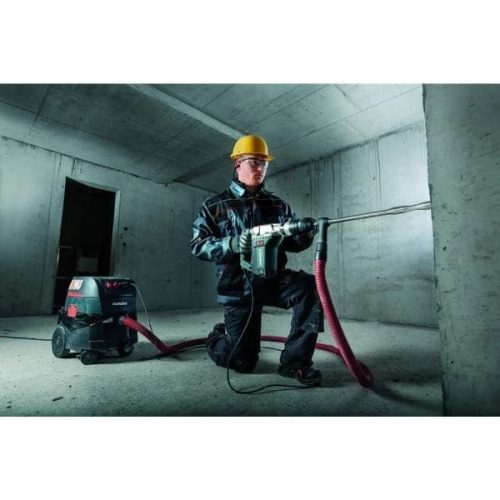 Metabo ASR 35 AutoCleanPlus All-Purpose Vacuum Cleaner positioned for dust extraction beside a work area