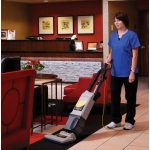 Worker using ProTeam 1500XP Upright Vacuum on a commercial carpeted floor