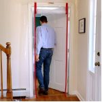 Person walking through ZipDoor Standard Door Kit rolled flap