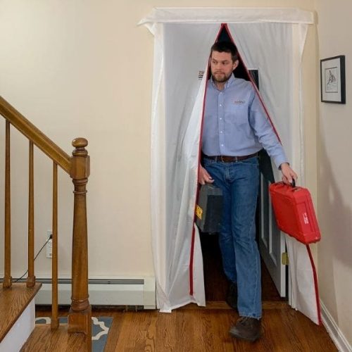 Person using ZipDoor Magnetic Door Kit installed in a residential doorway