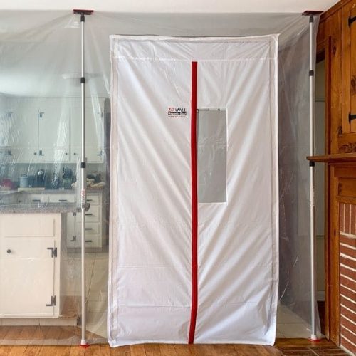 ZipDoor Magnetic Door Kit closed on a residential plastic containment barrier