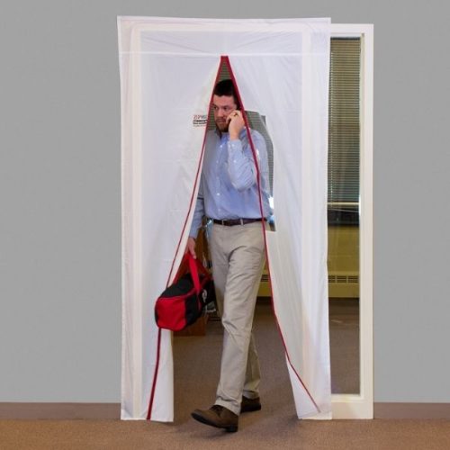 Person walking through ZipDoor Magnetic Door Kit installed in a commercial doorway