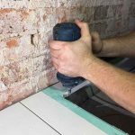Alpha vacuum brazed trimmer bit in use trimming a stone countertop edge