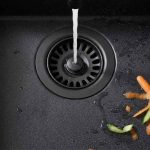Basket Strainer Chocolate installed in a kitchen sink in use