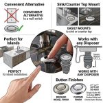 Chrome air switch in use near a sink