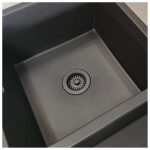 Black sand disposal flange installed in a sink basin