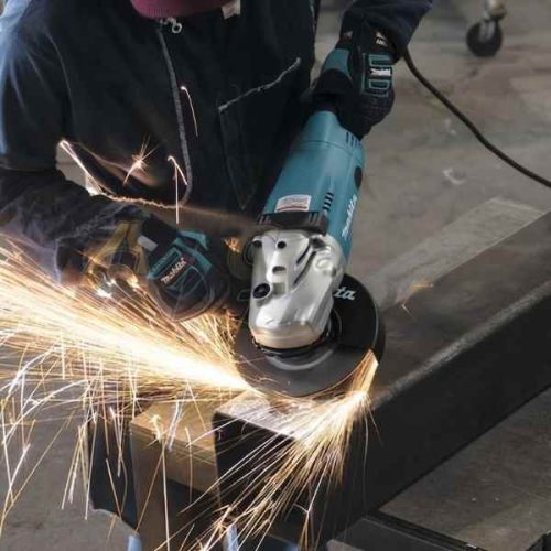Makita 7" Angle Grinder with AC/DC Switch GA7021 in use