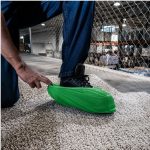ShieldTech Basics Standard Weight Protective Shoe Covers worn over footwear in a work area