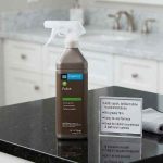 StoneTech Polish 24 oz Sprayer applied to a polished stone countertop