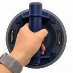 Worker using Weha 8" TuffCup Electric Battery Powered Cordless Vacuum Suction Cup to handle sheet material